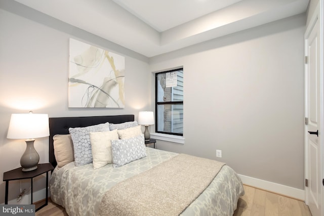 505 Kennedy St NW Unit B02, Washington, DC 20011 - bedroom featuring wood finished floors and a raised ceiling