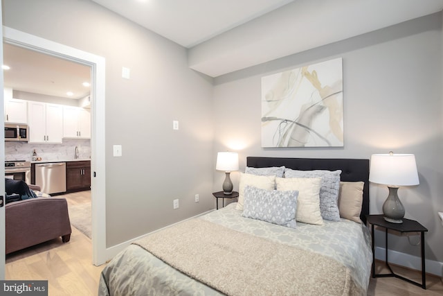 505 Kennedy St NW Unit B02, Washington, DC 20011 - bedroom with recessed lighting and light wood-style floors