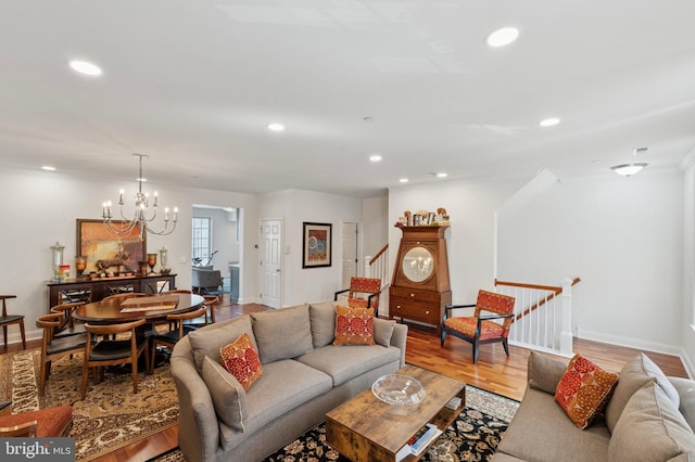406 Regatta Dr, Philadelphia, PA 19146 - living room featuring recessed lighting, light wood-style flooring, stairway, crown molding, and a chandelier