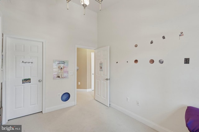 406 Regatta Dr, Philadelphia, PA 19146 - carpeted bedroom with baseboards and a towering ceiling
