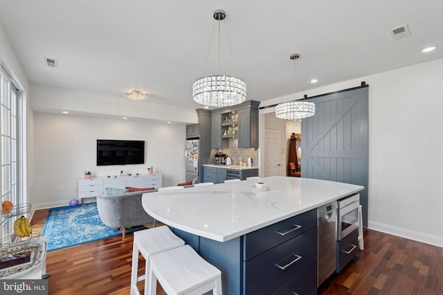 406 Regatta Dr, Philadelphia, PA 19146 - kitchen featuring dark wood-style flooring, a chandelier, light countertops, freestanding refrigerator, and recessed lighting