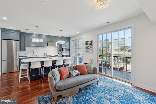 406 Regatta Dr, Philadelphia, PA 19146 - living area with a chandelier, dark wood-style floors, and recessed lighting