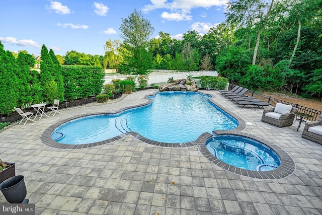 22 Tara Dr, Sewell, NJ 08080 - view of pool featuring a patio, a fenced backyard, a pool with connected hot tub, and view of scattered trees