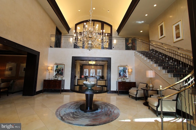 12500 Park Potomac Ave Unit 409, Potomac, MD 20854 - entryway with high vaulted ceiling, a chandelier, tile patterned flooring, stairway, and recessed lighting