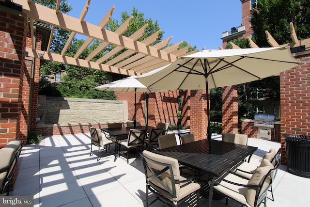 12500 Park Potomac Ave Unit 409, Potomac, MD 20854 - view of patio featuring outdoor dining space, an outdoor kitchen, and a pergola