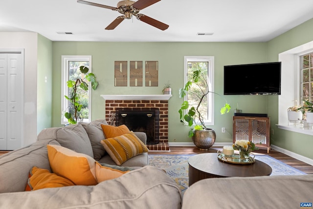 295 Homestead Ln, Charlottesville, VA 22902 - living room featuring wood finished floors, plenty of natural light, ceiling fan, and a fireplace