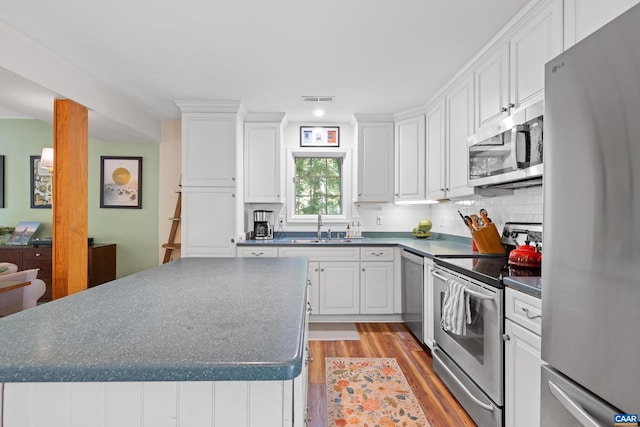 295 Homestead Ln, Charlottesville, VA 22902 - kitchen with appliances with stainless steel finishes, dark countertops, light wood-style floors, and recessed lighting