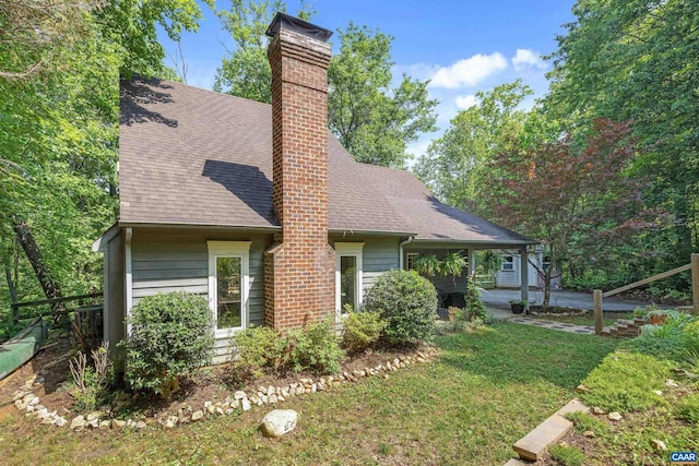 295 Homestead Ln, Charlottesville, VA 22902 - view of side of property with roof with shingles, a chimney, and a yard