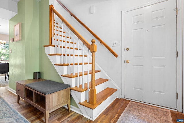 295 Homestead Ln, Charlottesville, VA 22902 - stairway with wood finished floors and a chandelier
