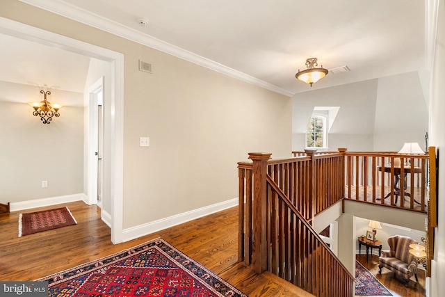 3054 Jordan Rd, Orefield, PA 18069 - stairway with wood finished floors, ornamental molding, and a chandelier