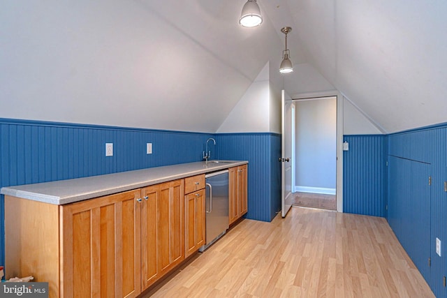 3054 Jordan Rd, Orefield, PA 18069 - kitchen featuring light wood finished floors, wainscoting, light countertops, lofted ceiling, and brown cabinetry