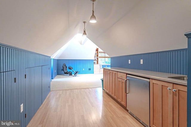 3054 Jordan Rd, Orefield, PA 18069 - kitchen with stainless steel dishwasher, light wood finished floors, light countertops, lofted ceiling, and decorative light fixtures