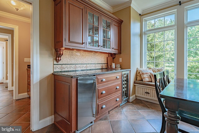 3054 Jordan Rd, Orefield, PA 18069 - kitchen with decorative backsplash, brown cabinets, glass insert cabinets, crown molding, and tile patterned flooring