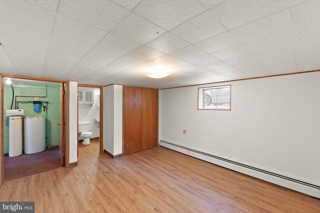 412 Fairview Ave, Winchester, VA 22601 - unfurnished bedroom featuring a baseboard heating unit and light wood-style flooring