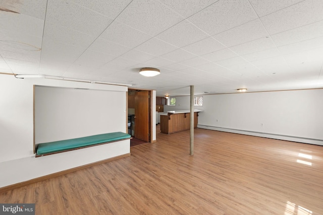 412 Fairview Ave, Winchester, VA 22601 - below grade area with light wood-type flooring and a baseboard radiator