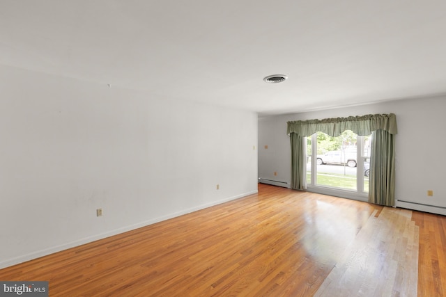 412 Fairview Ave, Winchester, VA 22601 - unfurnished room with a baseboard radiator and light wood-style floors
