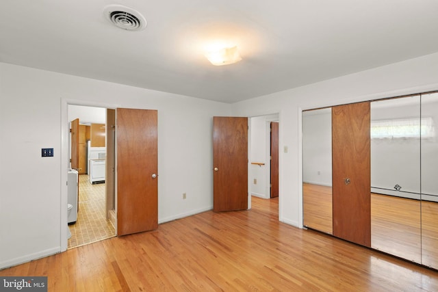 412 Fairview Ave, Winchester, VA 22601 - unfurnished bedroom with light wood finished floors and a baseboard radiator