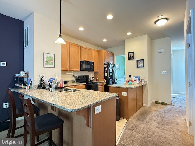 45657 Bethfield Way, California, MD 20619 - kitchen featuring black appliances, a peninsula, light colored carpet, a breakfast bar area, and recessed lighting