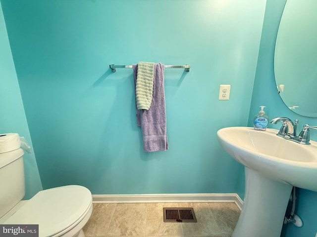 45657 Bethfield Way, California, MD 20619 - half bathroom with toilet and tile patterned floors