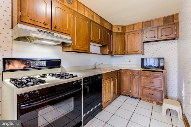 257 Westpark Ln, Clifton Heights, PA 19018 - kitchen featuring black appliances, under cabinet range hood, wallpapered walls, light countertops, and light tile patterned flooring