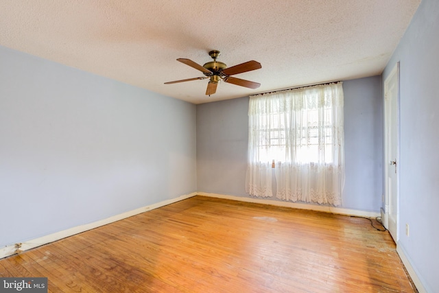 257 Westpark Ln, Clifton Heights, PA 19018 - spare room with wood finished floors, a textured ceiling, and a ceiling fan