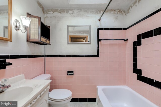 257 Westpark Ln, Clifton Heights, PA 19018 - full bathroom featuring tile walls, vanity, and wainscoting