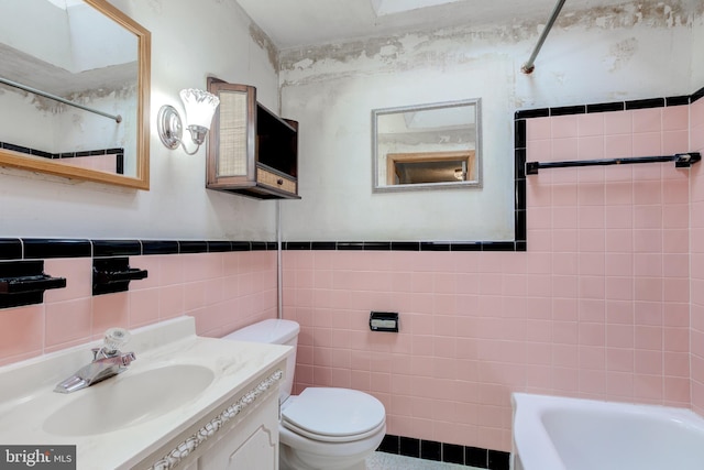257 Westpark Ln, Clifton Heights, PA 19018 - bathroom with tile walls, a shower, a tub to relax in, vanity, and wainscoting