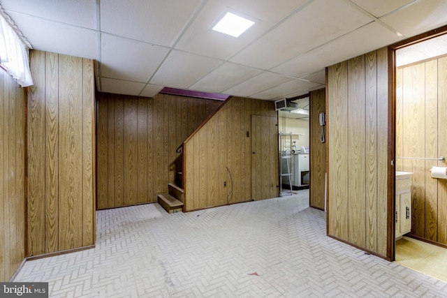 257 Westpark Ln, Clifton Heights, PA 19018 - finished basement featuring stairs, wood walls, a paneled ceiling, and washer / dryer