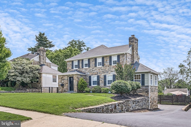 14 Brandywine Blvd, Wilmington, DE 19809 - view of front of home with stone siding, a chimney, and roof with shingles