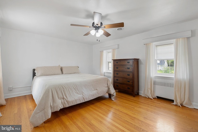 14 Brandywine Blvd, Wilmington, DE 19809 - bedroom featuring radiator, light wood-style flooring, and a ceiling fan