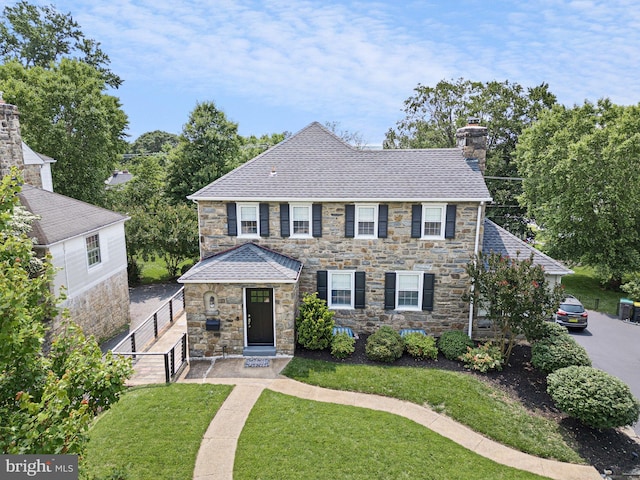14 Brandywine Blvd, Wilmington, DE 19809 - view of front of home featuring a chimney, stone siding, and a shingled roof