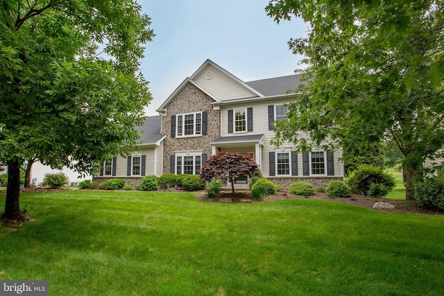 3879 Charter Club Dr, Doylestown, PA 18902 - view of front facade with stone siding, a front lawn, and roof with shingles