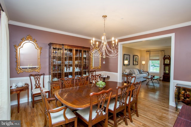 3879 Charter Club Dr, Doylestown, PA 18902 - dining room with wood finished floors, a chandelier, and crown molding