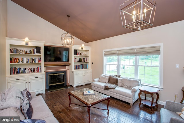 3879 Charter Club Dr, Doylestown, PA 18902 - living area with a chandelier, lofted ceiling, dark wood-style floors, and a glass covered fireplace