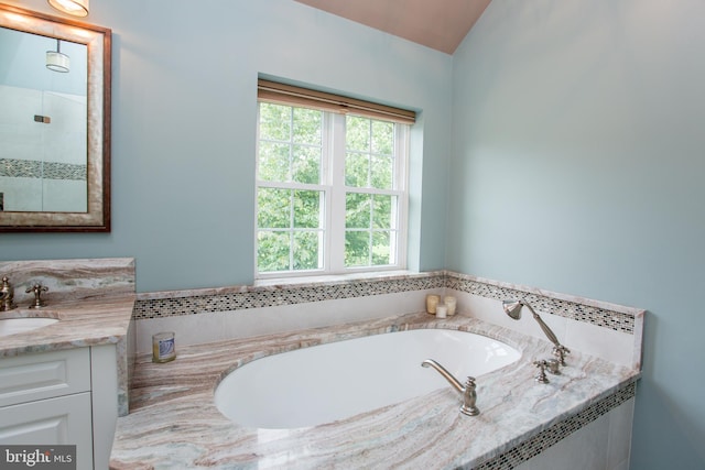 3879 Charter Club Dr, Doylestown, PA 18902 - full bath with vanity, a bath, lofted ceiling, and tiled shower