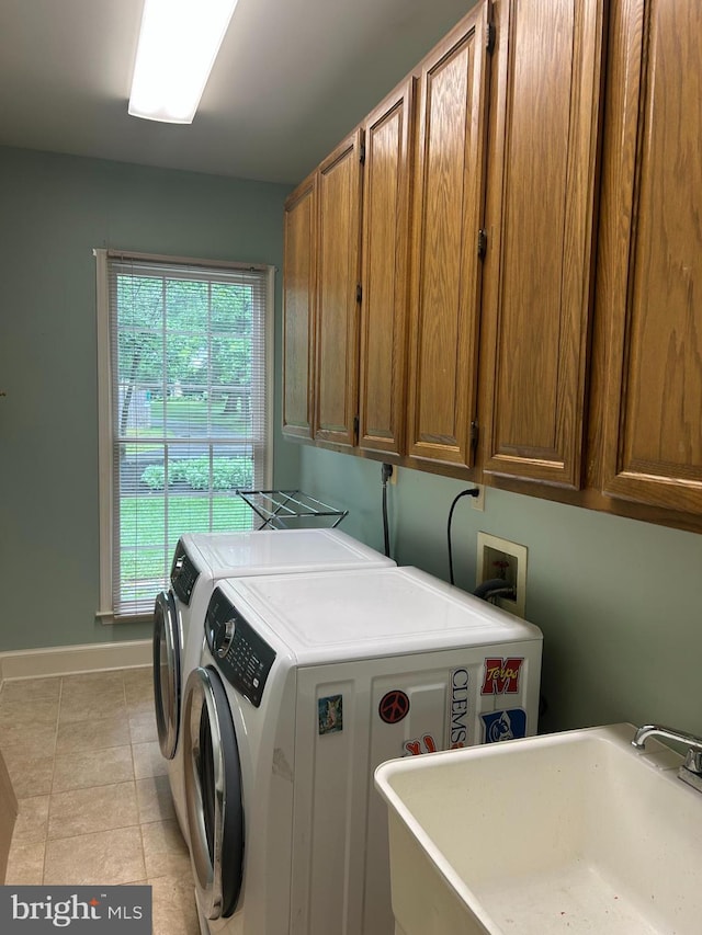 1600 Old Mill Bottom Run, Annapolis, MD 21409 - washroom featuring cabinet space, washer and dryer, and light tile patterned floors