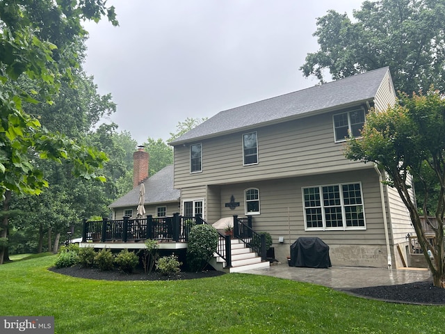 1600 Old Mill Bottom Run, Annapolis, MD 21409 - back of property featuring a yard, a wooden deck, a patio, and a chimney