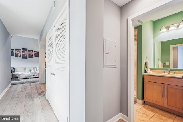 3240 Hiatt Pl NW Unit 4, Washington, DC 20010 - hall featuring a sink and light wood finished floors