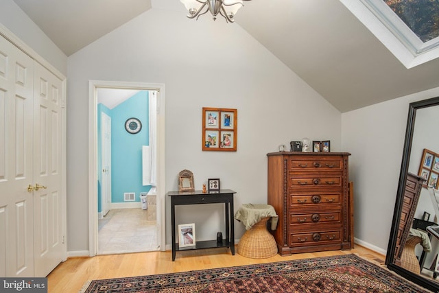 11603 Auburn Grove Ct, Reston, VA 20194 - interior space with lofted ceiling, light wood finished floors, and a chandelier