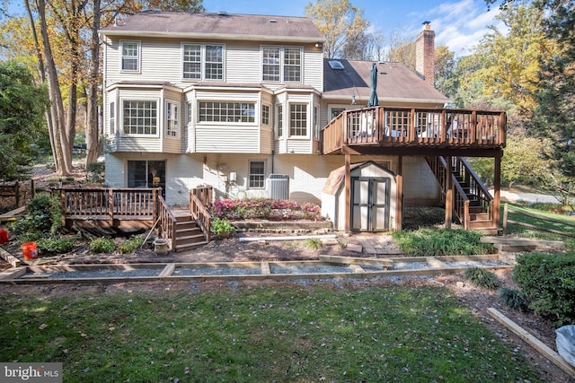 11603 Auburn Grove Ct, Reston, VA 20194 - rear view of house with stairs, a deck, a storage unit, and a chimney