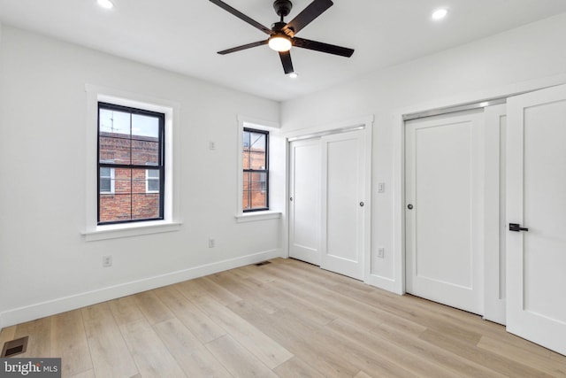 2012 S Mildred St, Philadelphia, PA 19148 - unfurnished bedroom featuring two closets, recessed lighting, light wood-style floors, and a ceiling fan