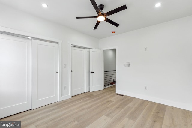 2012 S Mildred St, Philadelphia, PA 19148 - unfurnished bedroom with multiple closets, light wood finished floors, recessed lighting, and a ceiling fan