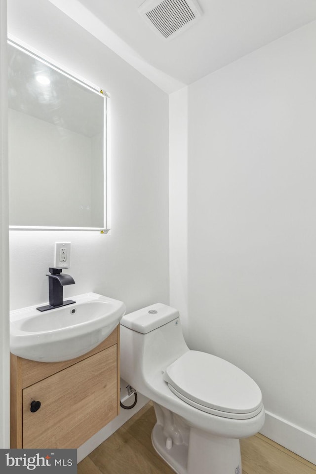 2012 S Mildred St, Philadelphia, PA 19148 - half bathroom featuring vanity and wood finished floors