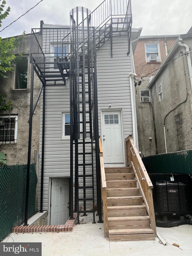 1107 N Fulton Ave, Baltimore, MD 21217 - rear view of house featuring entry steps and cooling unit