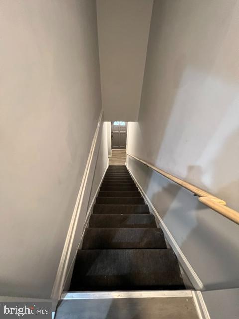 1107 N Fulton Ave, Baltimore, MD 21217 - stairs featuring baseboards