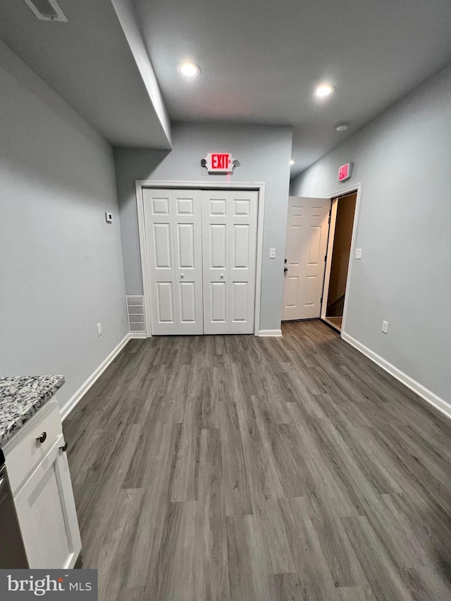 1107 N Fulton Ave, Baltimore, MD 21217 - unfurnished living room featuring dark wood-style flooring and recessed lighting