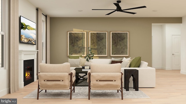 36 Aaron Truehart Way, Titusville, NJ 08560 - living area featuring a ceiling fan, light wood-style flooring, and a glass covered fireplace