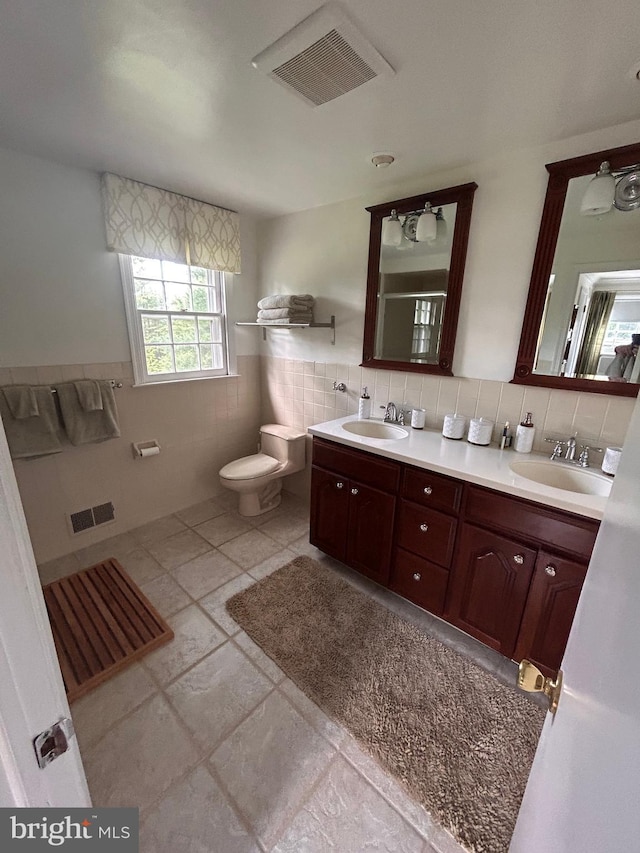 223 Country Gate Rd, Wayne, PA 19087 - full bath featuring tile walls, double vanity, a shower, and a wainscoted wall