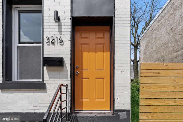 3216 N Randolph St, Philadelphia, PA 19140 - doorway to property with brick siding