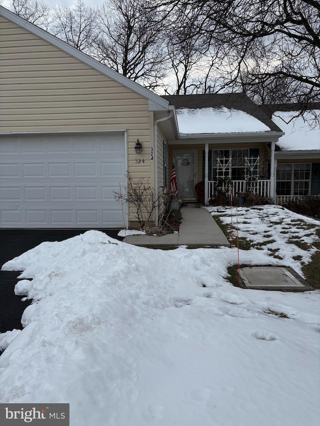 324 Winners Cir Unit 324, Red Lion, PA 17356 - view of front of home with an attached garage and a porch